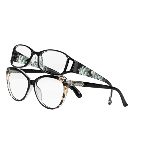 Two pairs of prescription glasses with black frames; one has a floral pattern on the temples, and the other features a mix of black and tortoiseshell with a rhinestone detail, isolated on a white background.